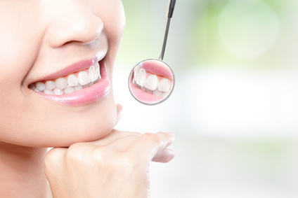 Healthy woman teeth and dentist mouth mirror